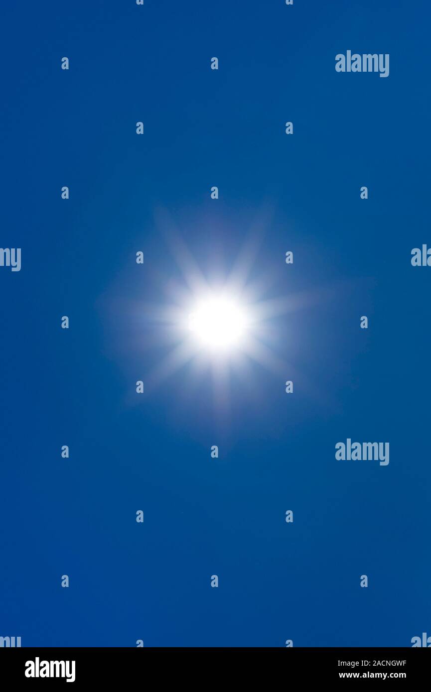 Sun in a blue sky Stock Photo - Alamy