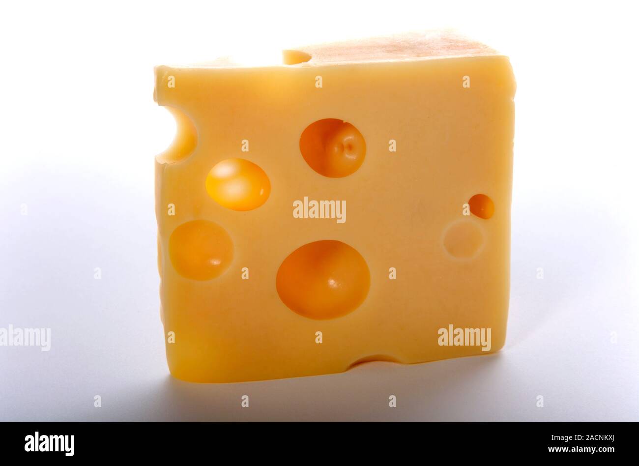 Emmental cheese. The holes in this Swiss cow's milk cheese form due to