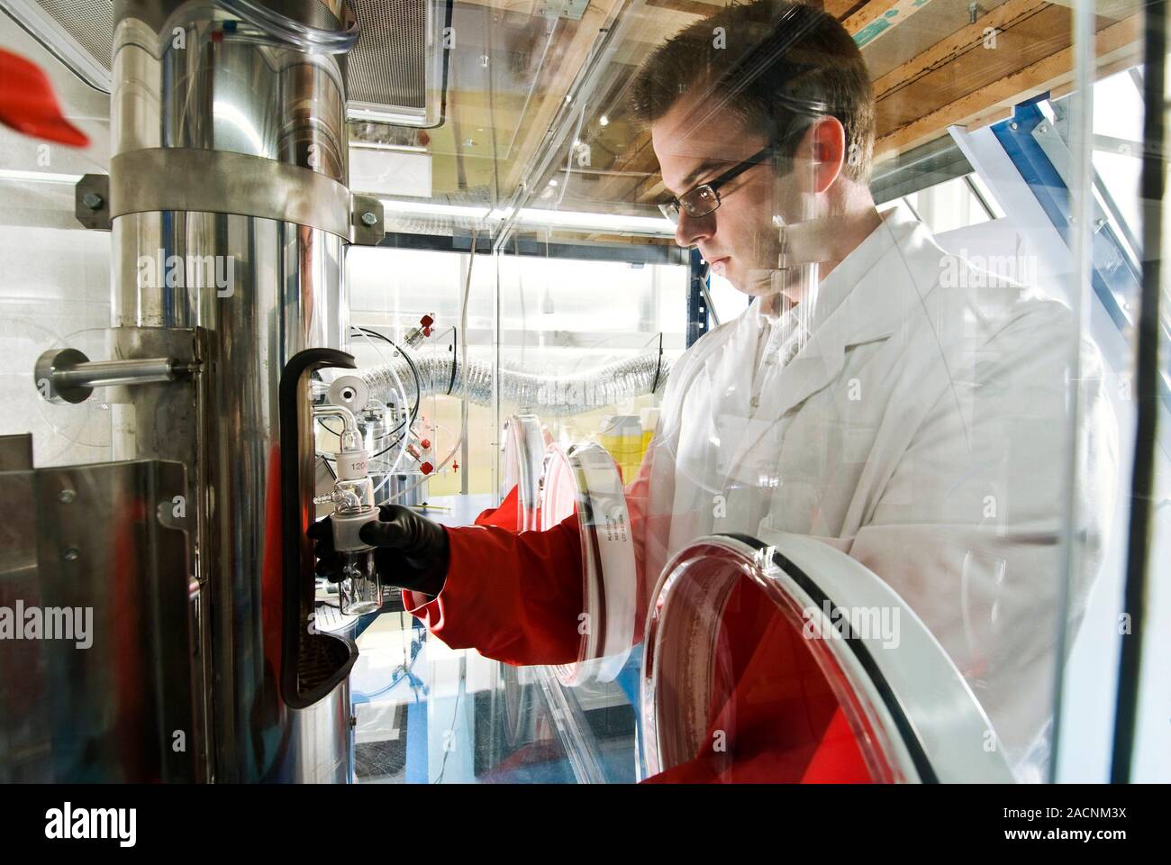 Biological testing system. Biologist working with a system that is used