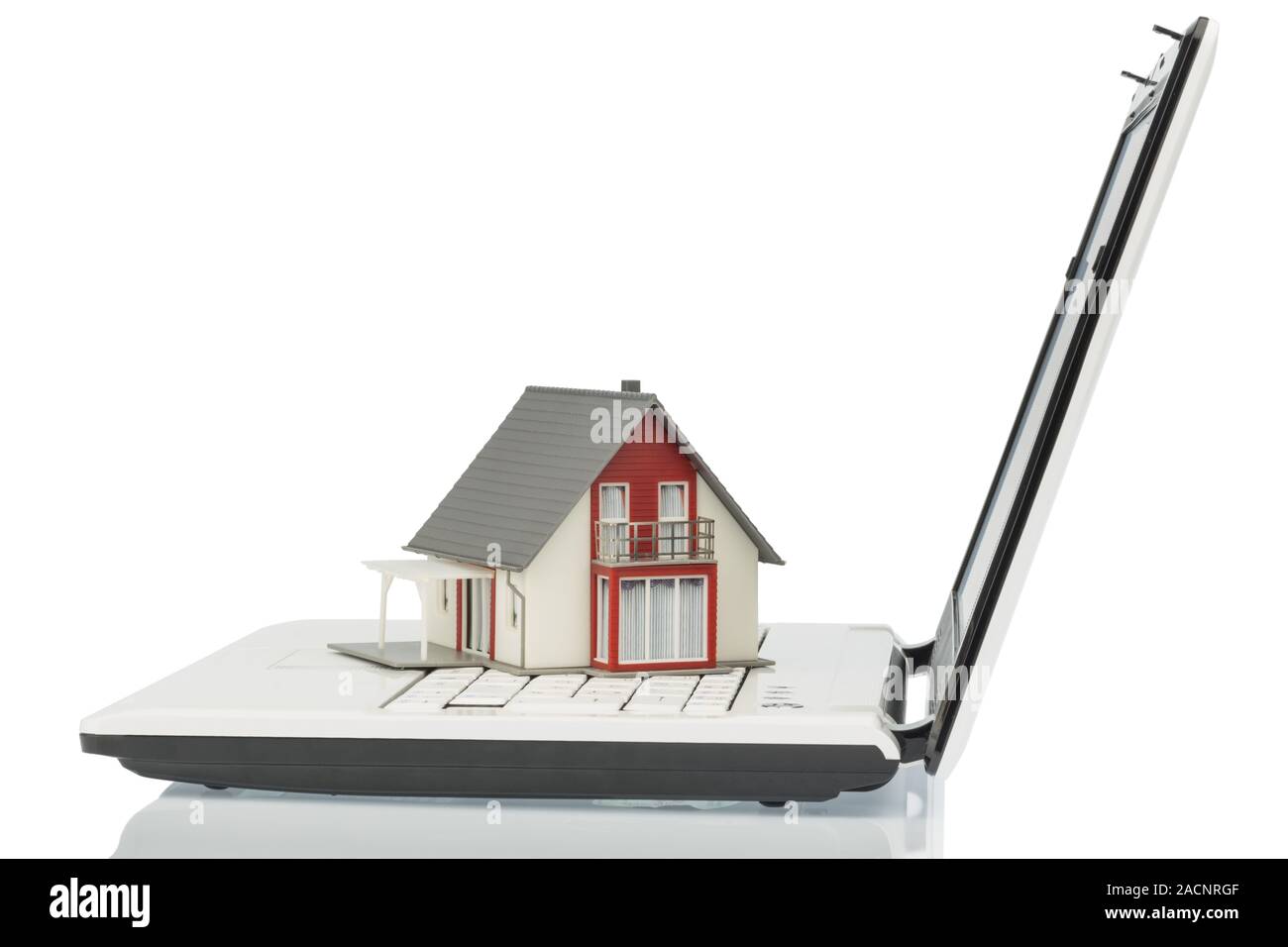 Residential house on computer keyboard Stock Photo Alamy