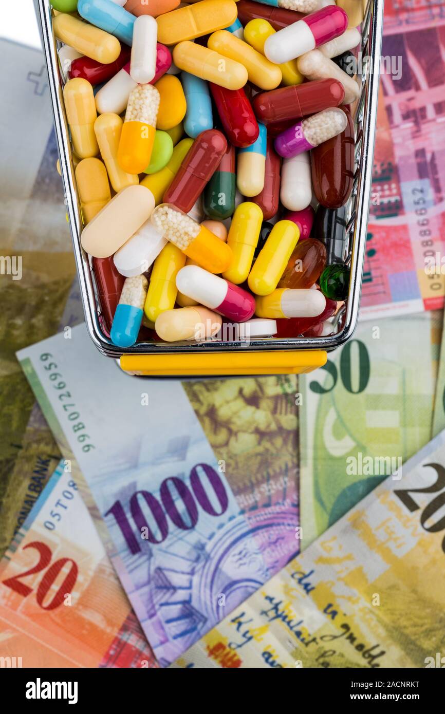 Tablets, shopping trolleys, banknotes Stock Photo