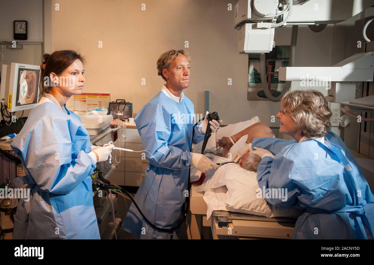 Endoscopy. Doctor performing an endoscopy on a patient. Photographed in ...