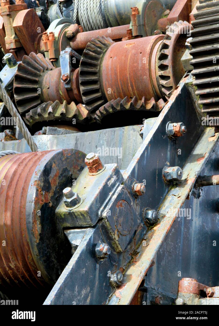 Industrial cogs and pulley wheels. Close-up of rusting cogs, pulleys ...