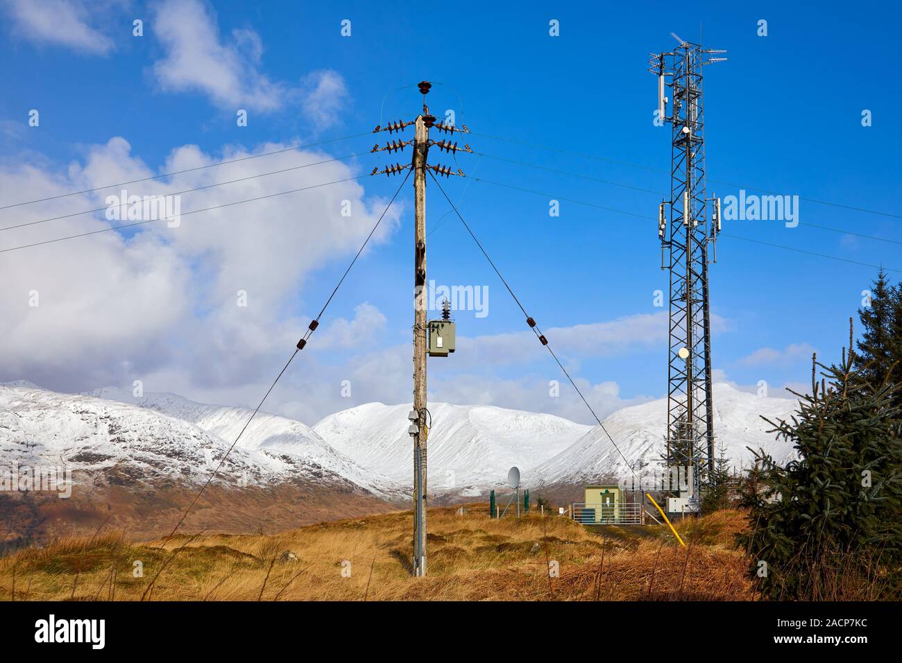 Hilltop communication mast TV UHF transmitter and telegraph pole, Dalmally, Scotland Stock Photo