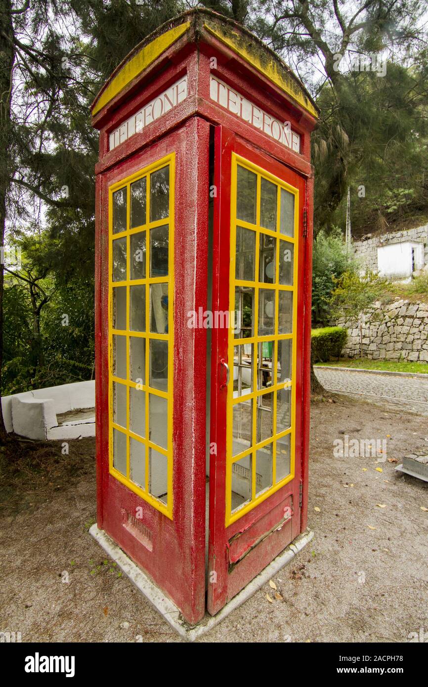 cool red and yellow phone booth Stock Photo