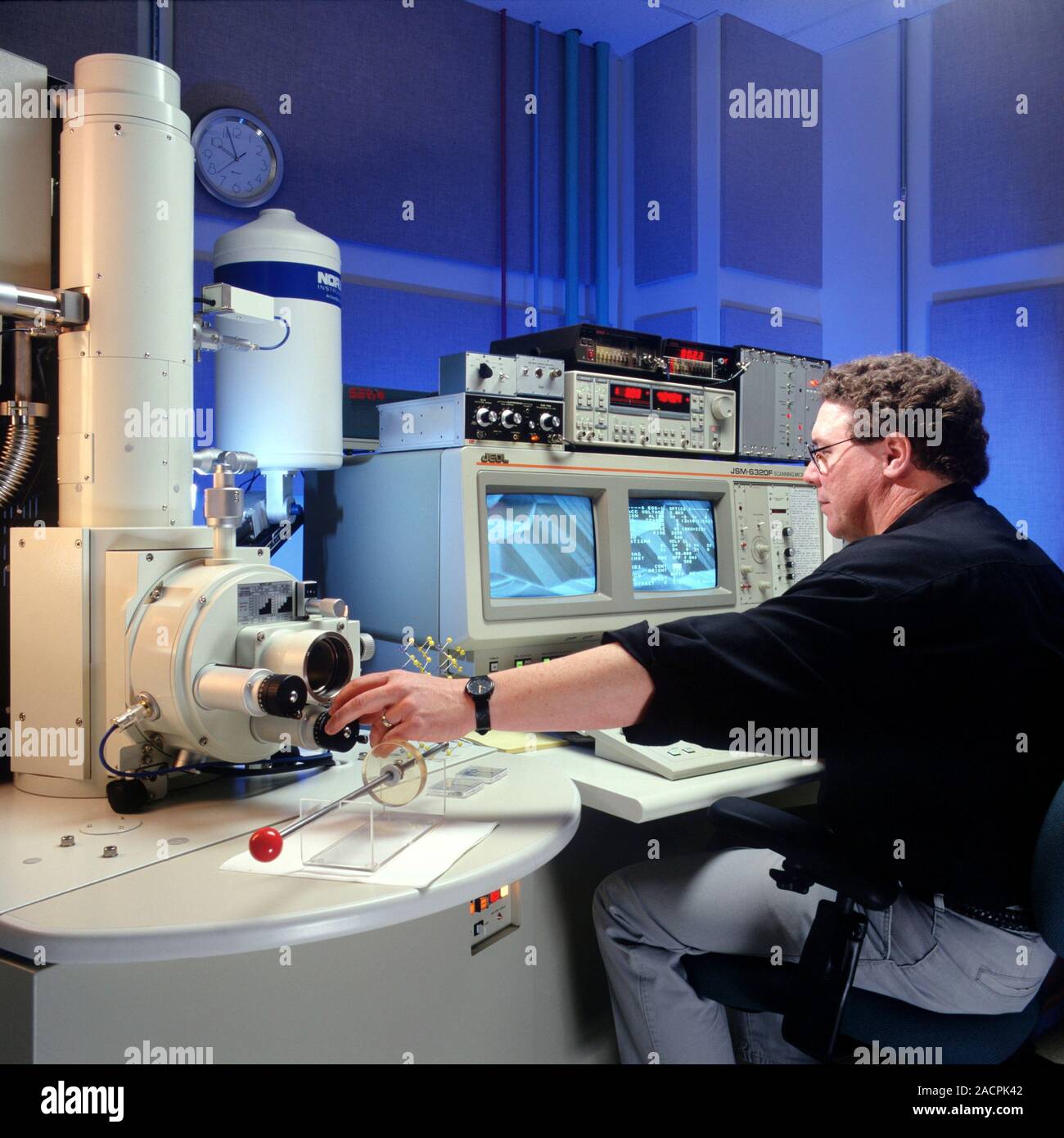 Scanning electron microscopy. Researcher using a scanning electron ...