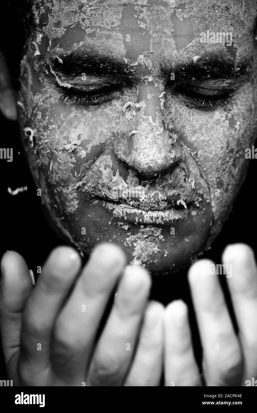 Man peeling off mask hi-res stock photography and images - Alamy