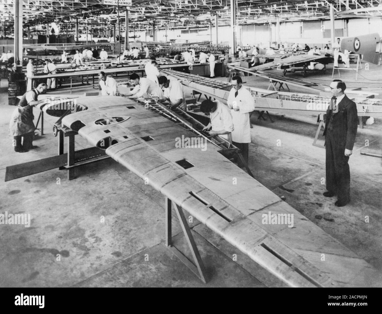 Aircraft parts factory. Workers assembling and manufacturing aircraft