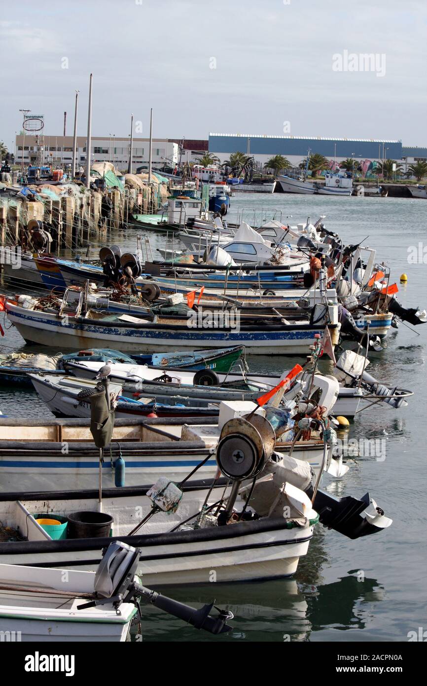 Fishing boats on docks Stock Photo