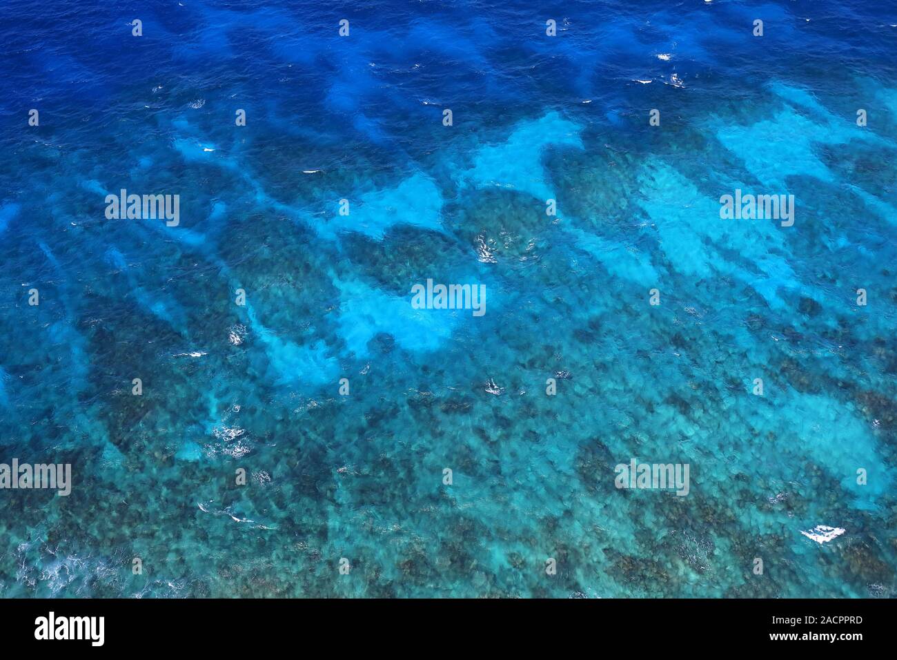 Aerial view on the natural wonder of the Great Barrier Reef in front of the east coast of Australia Stock Photo