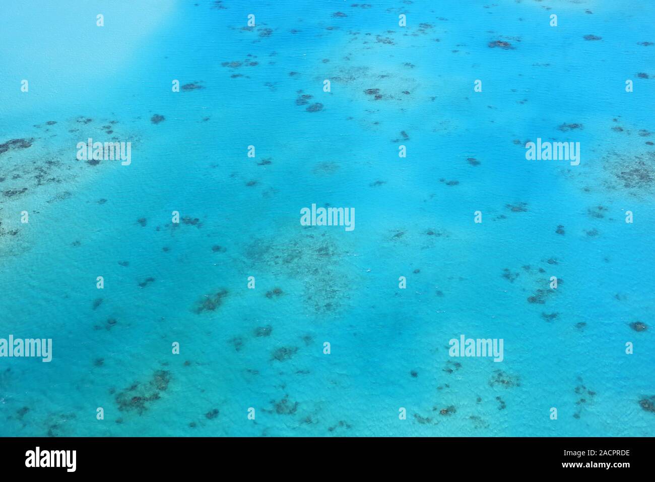 Aerial view on the natural wonder of the Great Barrier Reef in front of the east coast of Australia Stock Photo