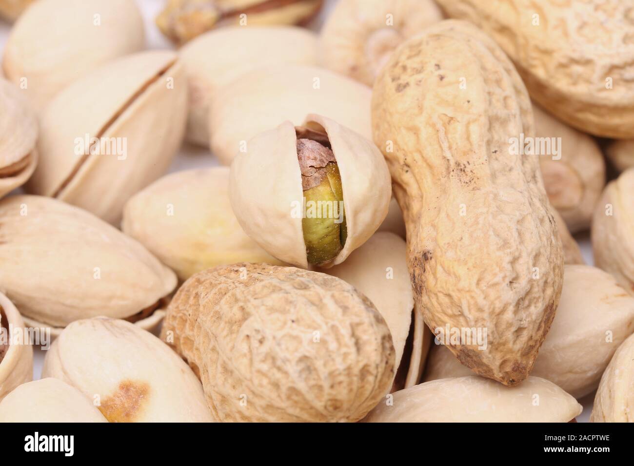 One open pistachio and peanuts Stock Photo Alamy