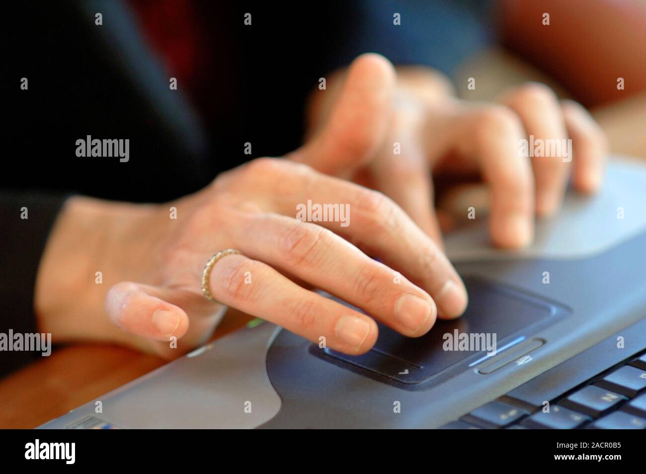 Laptop computer touchpad. Closeup of a person using a touchsensitive