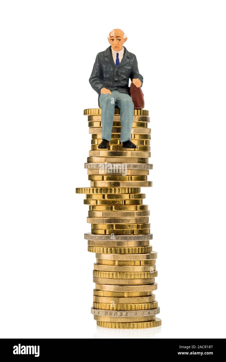 Pensioner is sitting on a pile of money Stock Photo