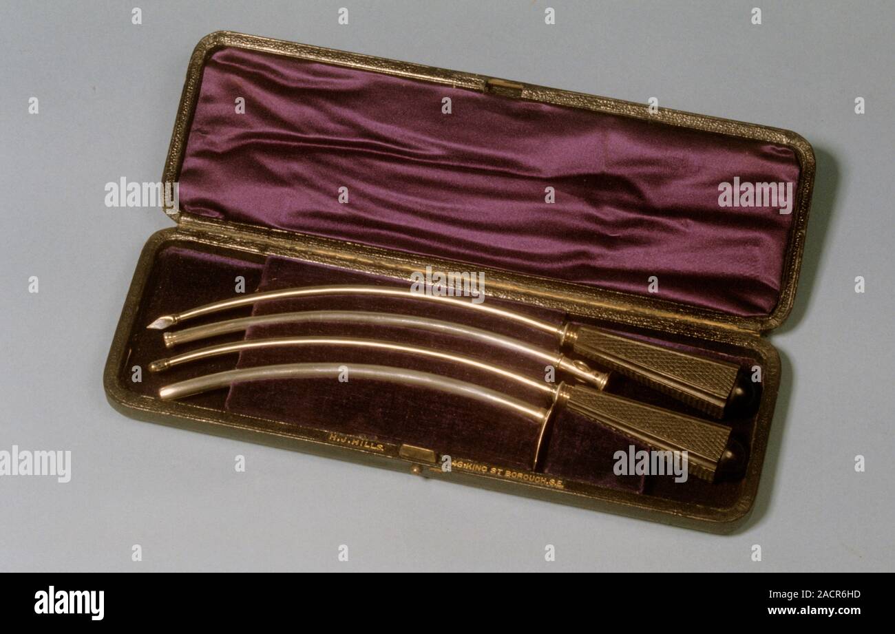 Edged Instrument Gold coloured metal pair of curved trocars and cannulae with case ...