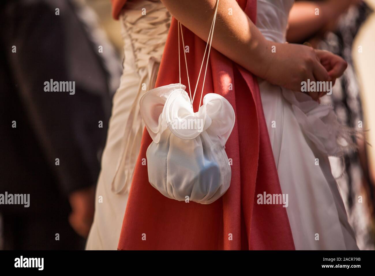 bride carrying bag Stock Photo Alamy