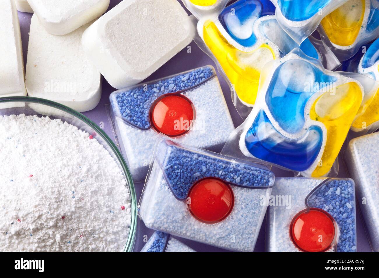 Biological dishwasher detergents. Closeup of liquid, tablet, and powder forms for dishwasher