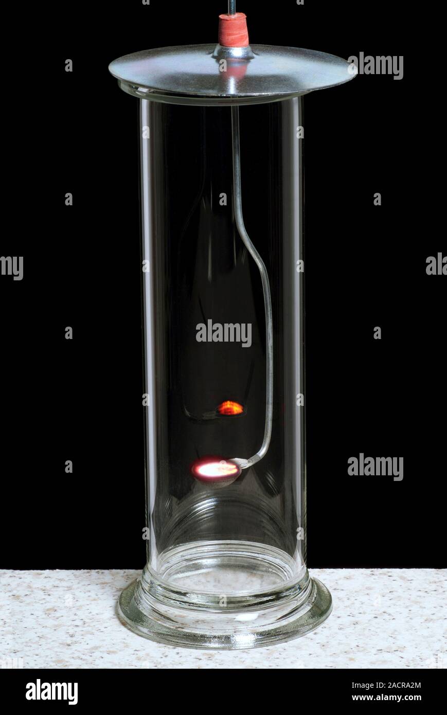 Carbon combustion experiment. Heated carbon powder (glowing) being