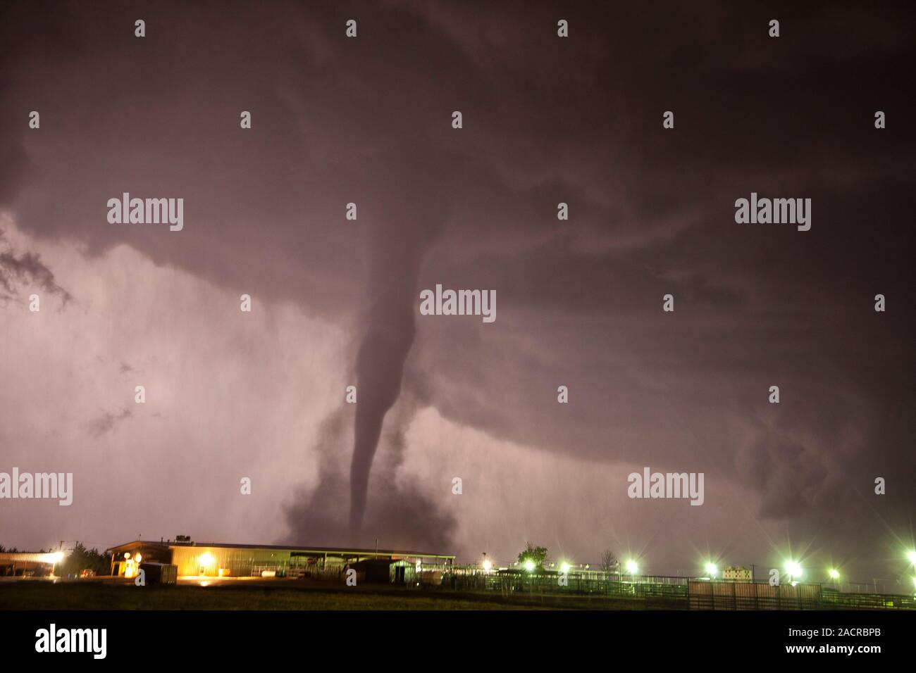 Tornado at night. A tornado is a violent rotating column of air