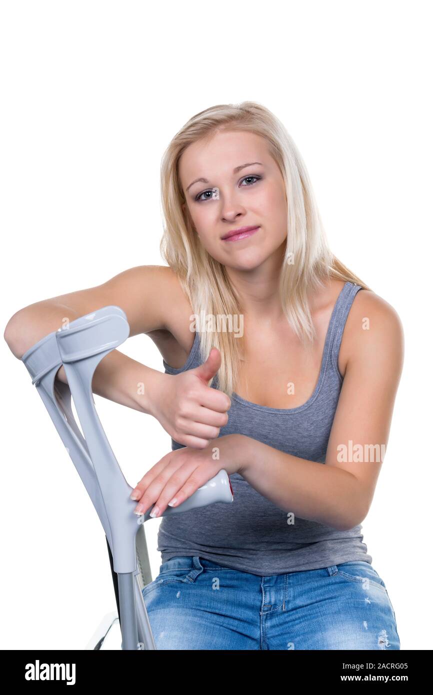 Woman with crutches Stock Photo