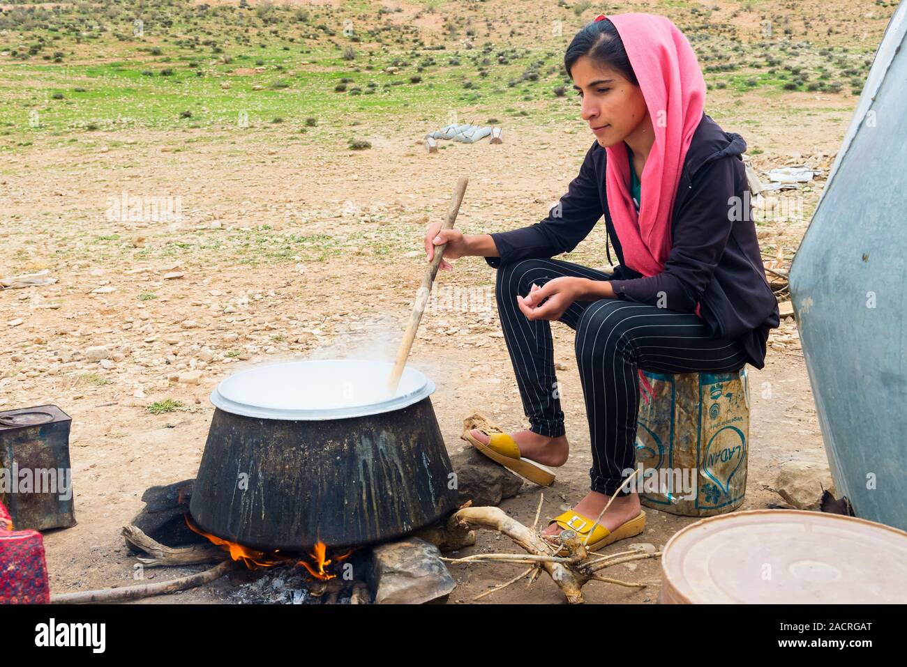 Qashqai woman boiling goat milk, Qashqai nomad camp, Fars Province