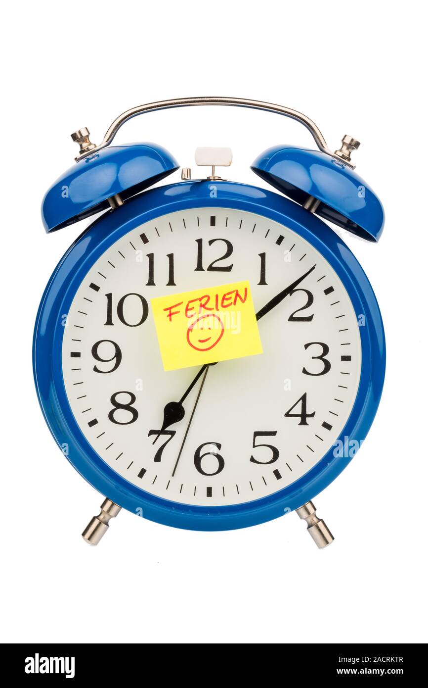 Alarm clock at the beginning of the holidays Stock Photo Alamy