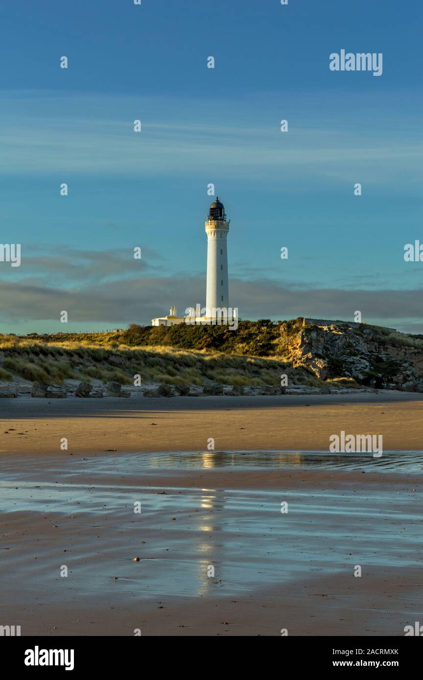 COVESEA LIGHTHOUSE LOSSIEMOUTH MORAY COAST SCOTLAND REFLECTED IN THE WET SAND OF THE BEACH Stock Photo