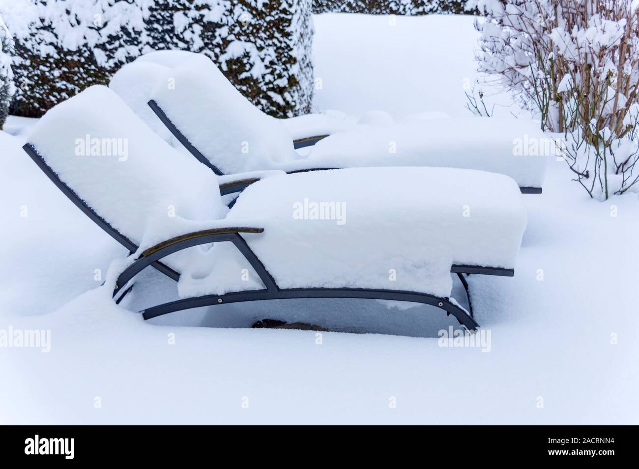 Snow-covered garden furniture Stock Photo