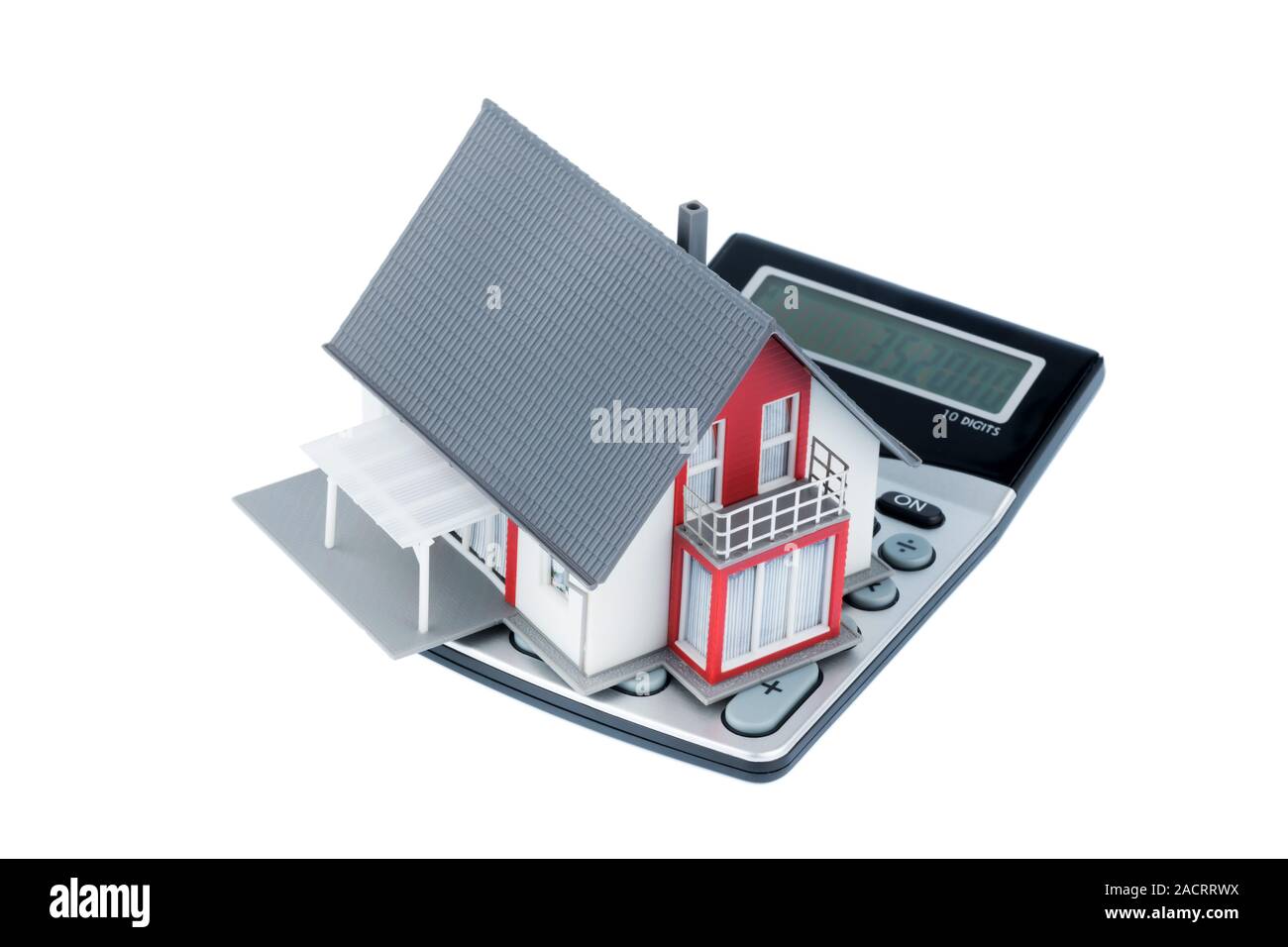 Residential house on calculator Stock Photo