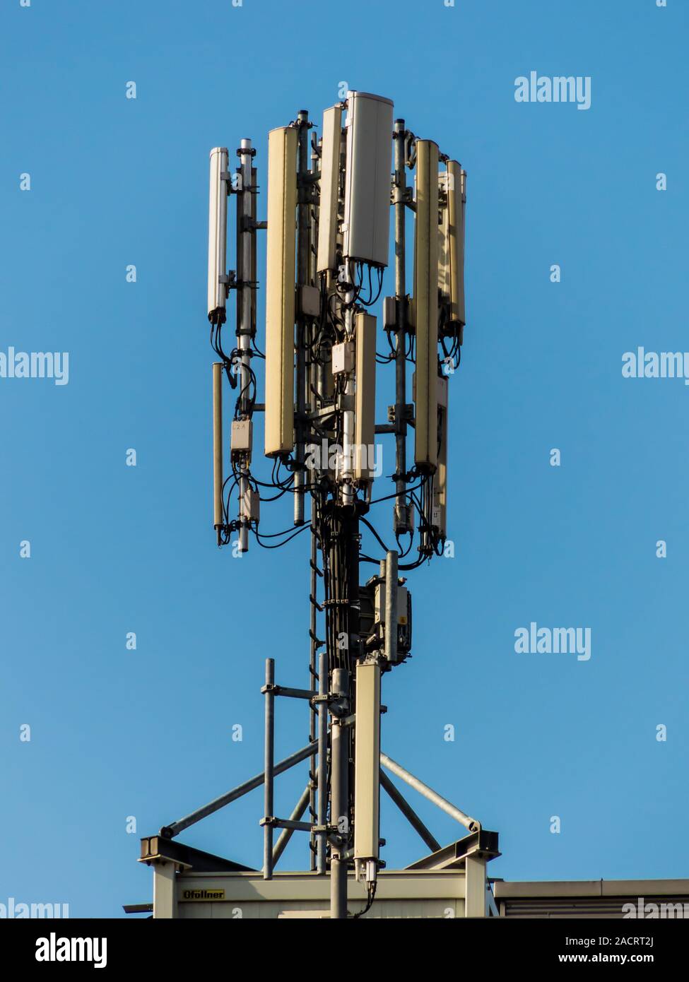 Mobile radio transmitter on the roof of a house Stock Photo - Alamy