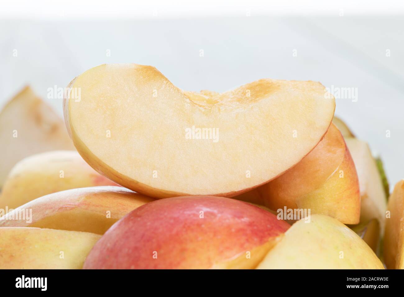 Slices of fresh red apple. a fresh apple quarter Stock Photo