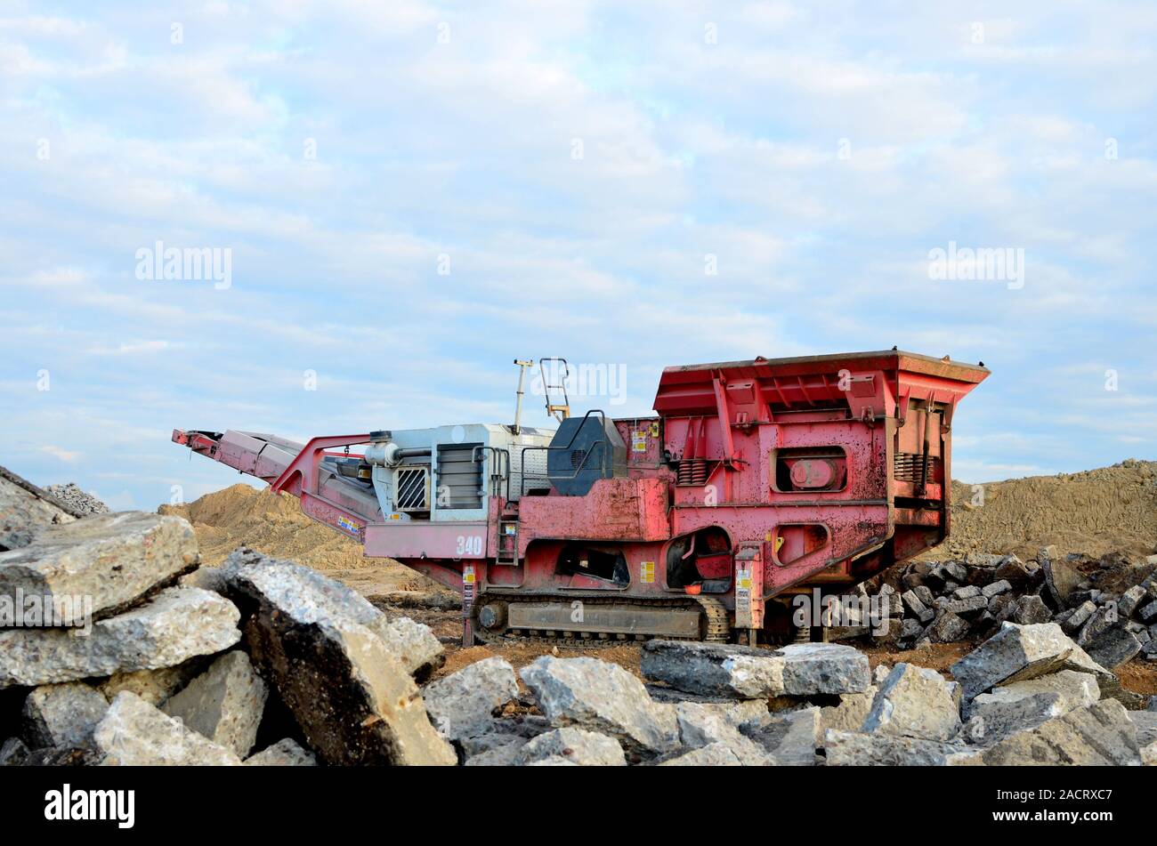 https://c8.alamy.com/comp/2ACRXC7/mobile-stone-crusher-machine-by-the-construction-site-or-mining-quarry-for-crushing-old-concrete-slabs-into-gravel-and-subsequent-cement-production-j-2ACRXC7.jpg