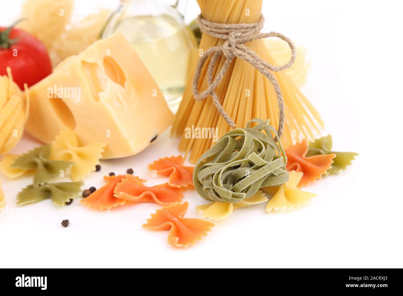 Different pasta, oil, tomato, cheese Stock Photo