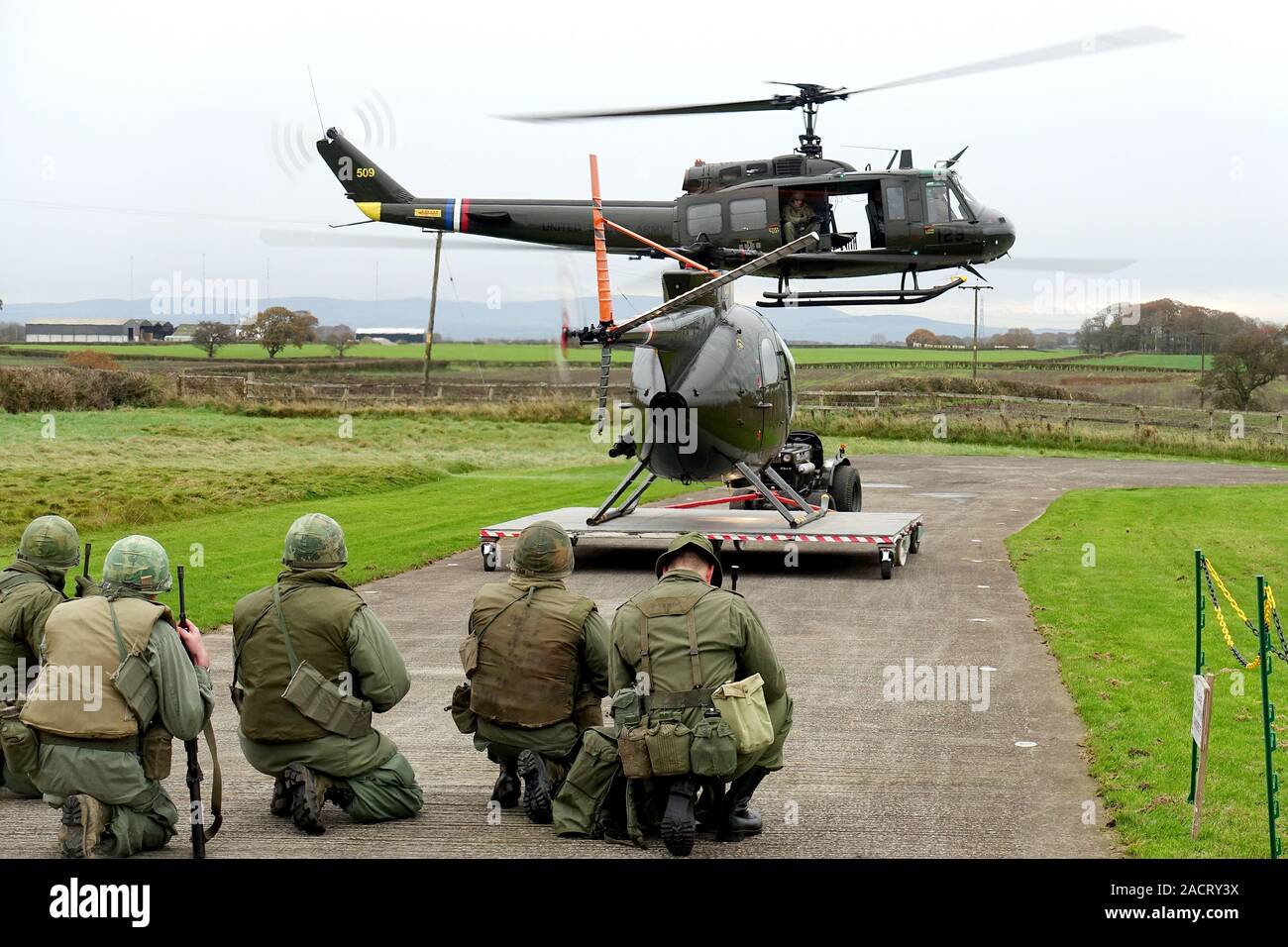 The only Vietnam War combat veteran helicopters in Britain – complete with patched up bullet holes – displaying at their base near Wesham, Lancashire Stock Photo