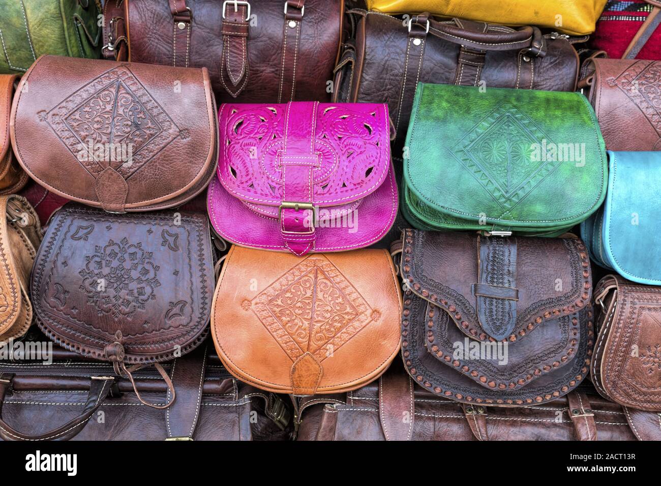 Different kind of leather purse bags colorful vibrant colors selling in the  Italian market shop Stock Photo by ©olena.sakhatska 289501334