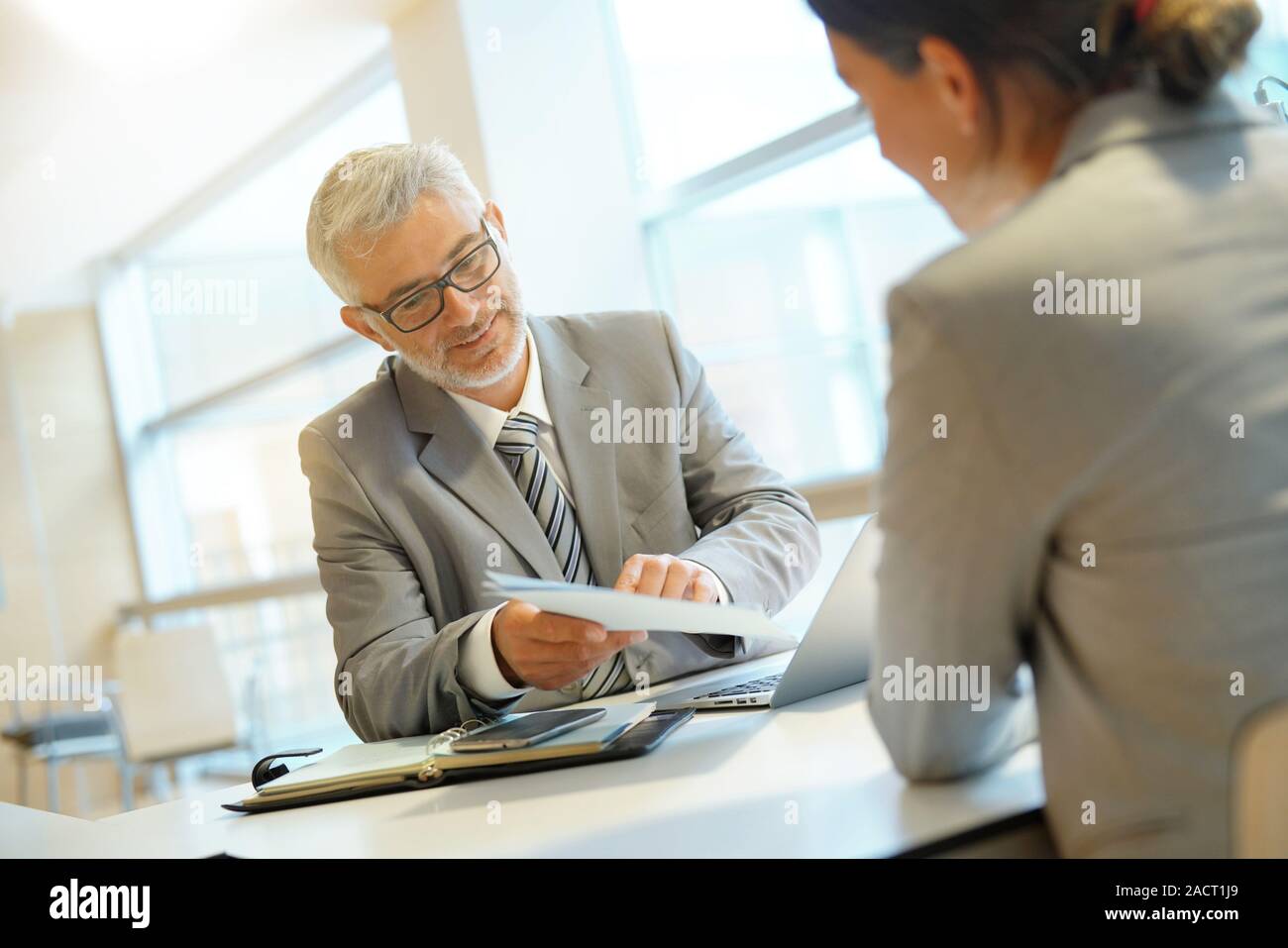 Coporate meeting between executive and employee Stock Photo