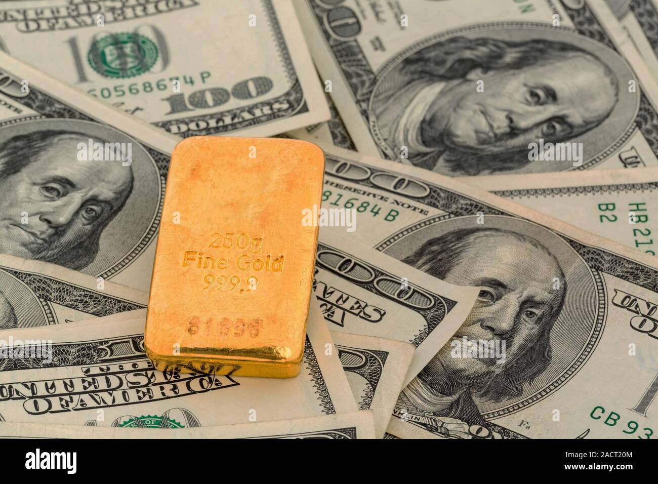 Gold bars on dollar bills Stock Photo Alamy