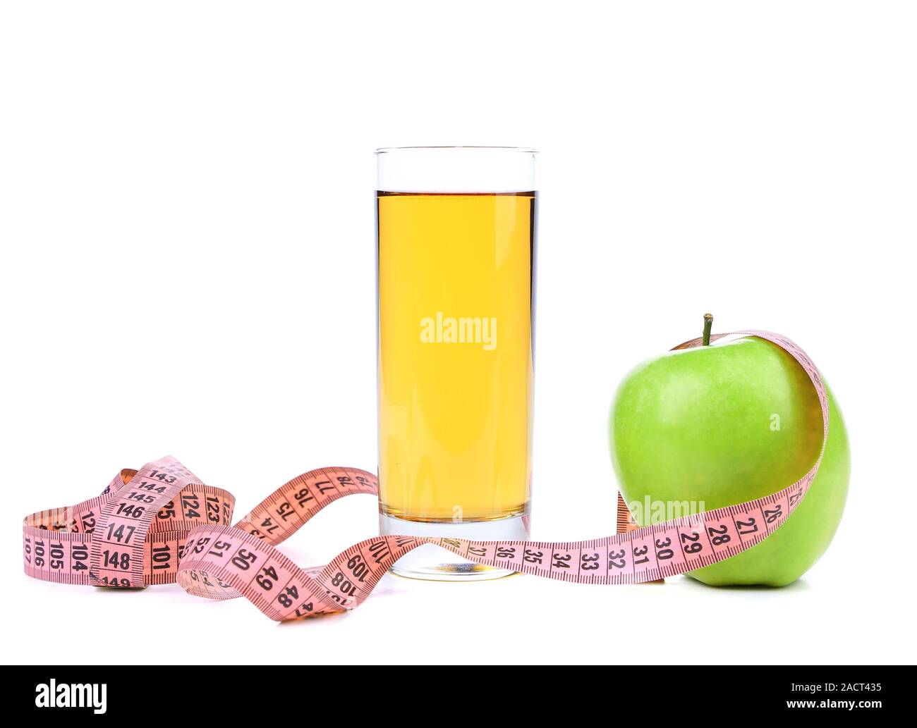 Juice and green apples measured the meter Stock Photo