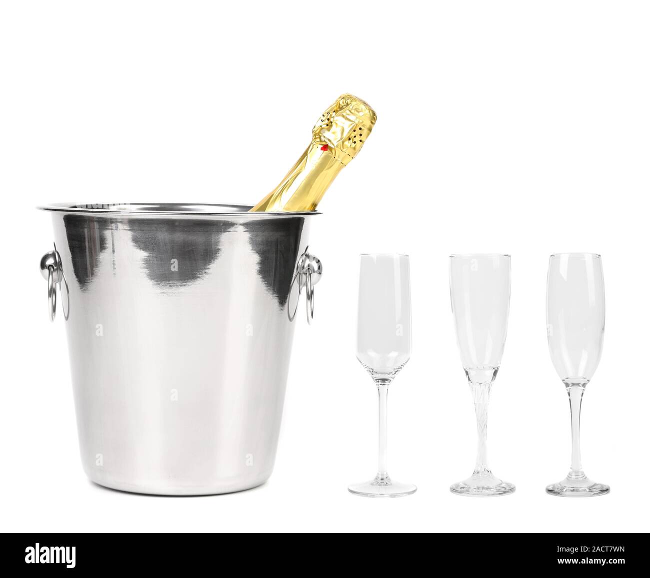 Bottle of champagne in cooler and three glasses. Stock Photo