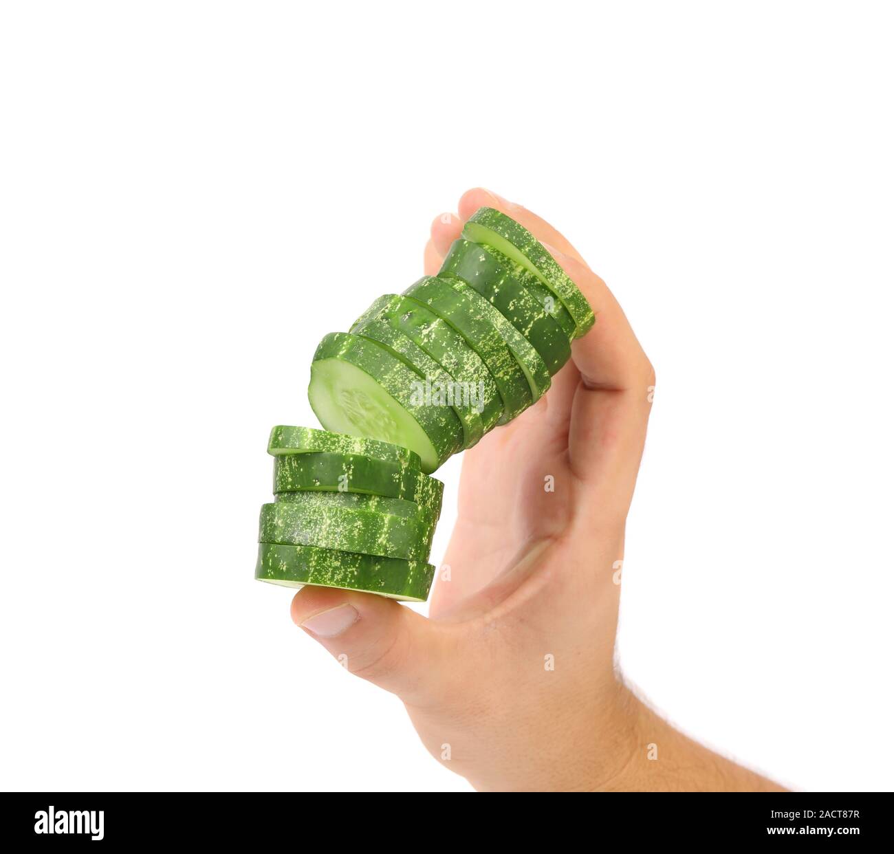 Hand holds stack juicy cucumber Stock Photo