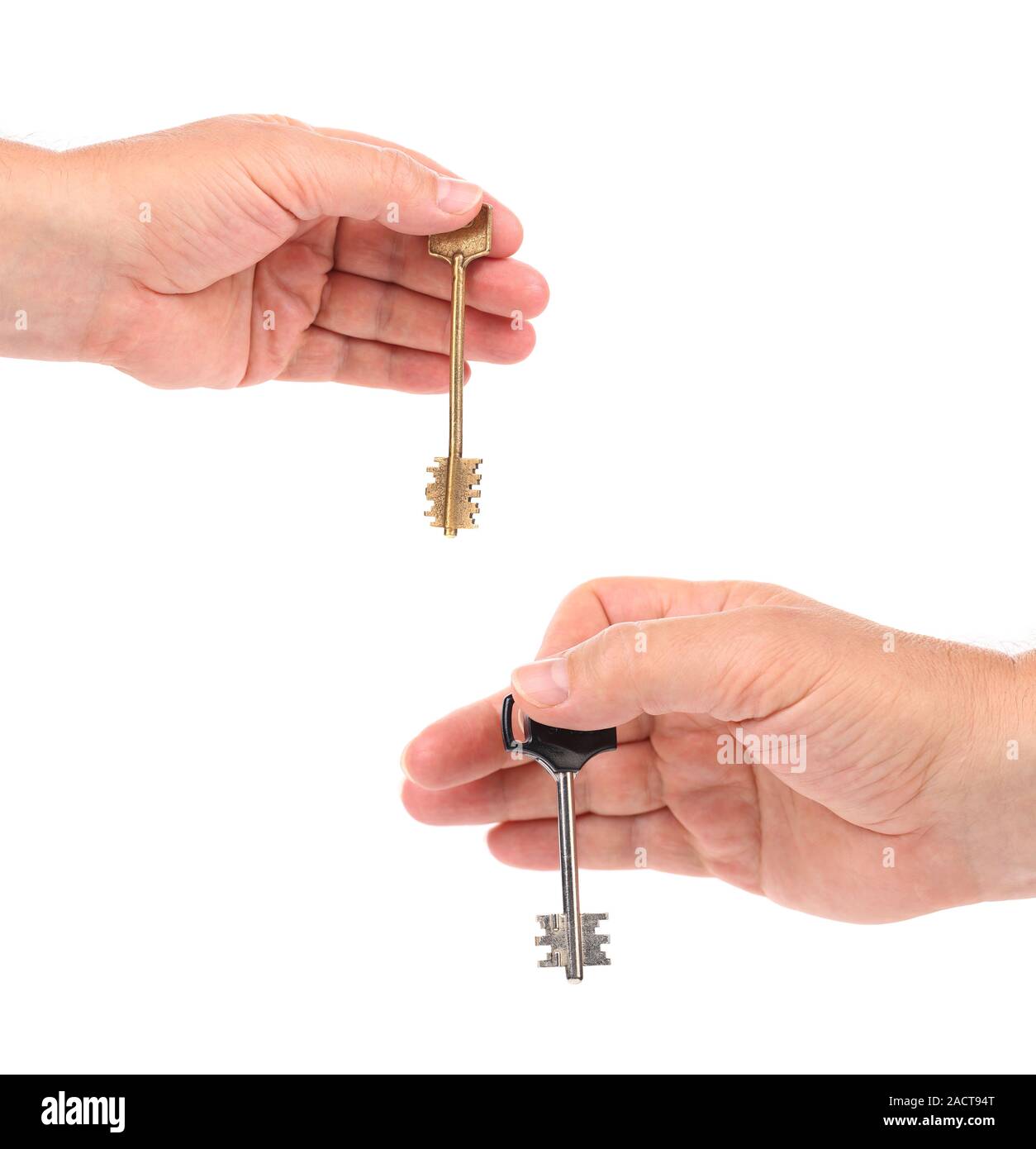 Hands holds modern steel-plastic and bronze key. Stock Photo