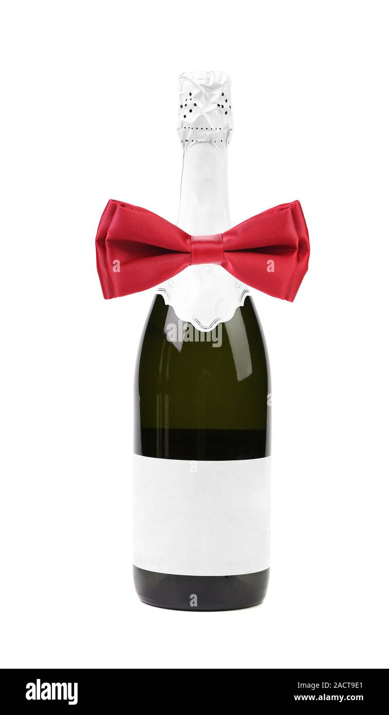 Bottle of champagne and red bow tie. Stock Photo