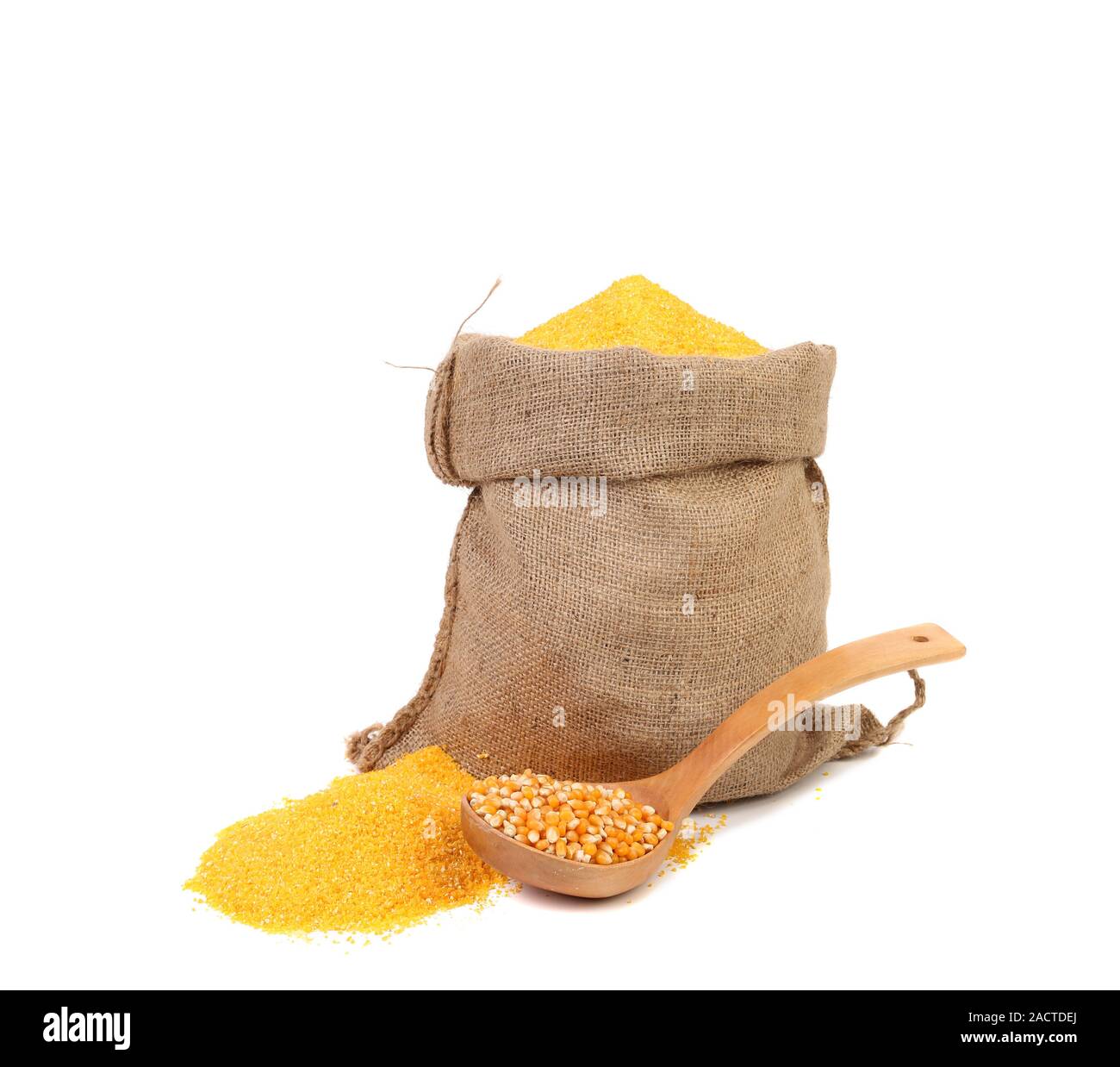 Bag of ground corn and a wooden spoon. Stock Photo