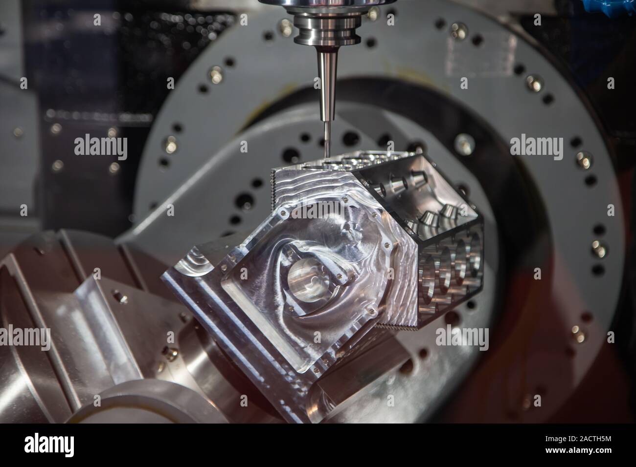 Modern industry CNC milling machine cutting sample workpiece Stock Photo