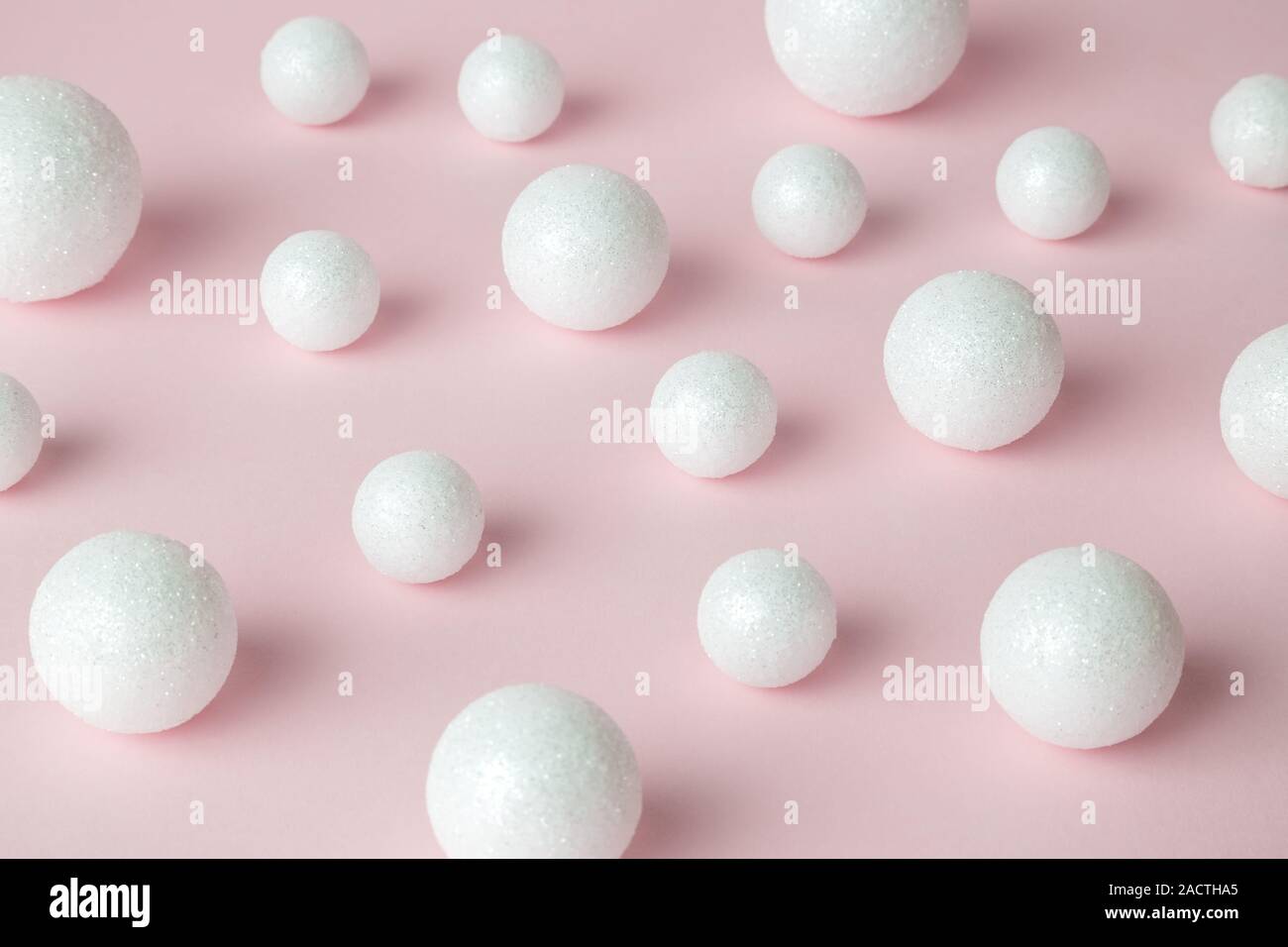 Bubbles made of styrofoam balls on pastel pink background minimal creative concept. Stock Photo