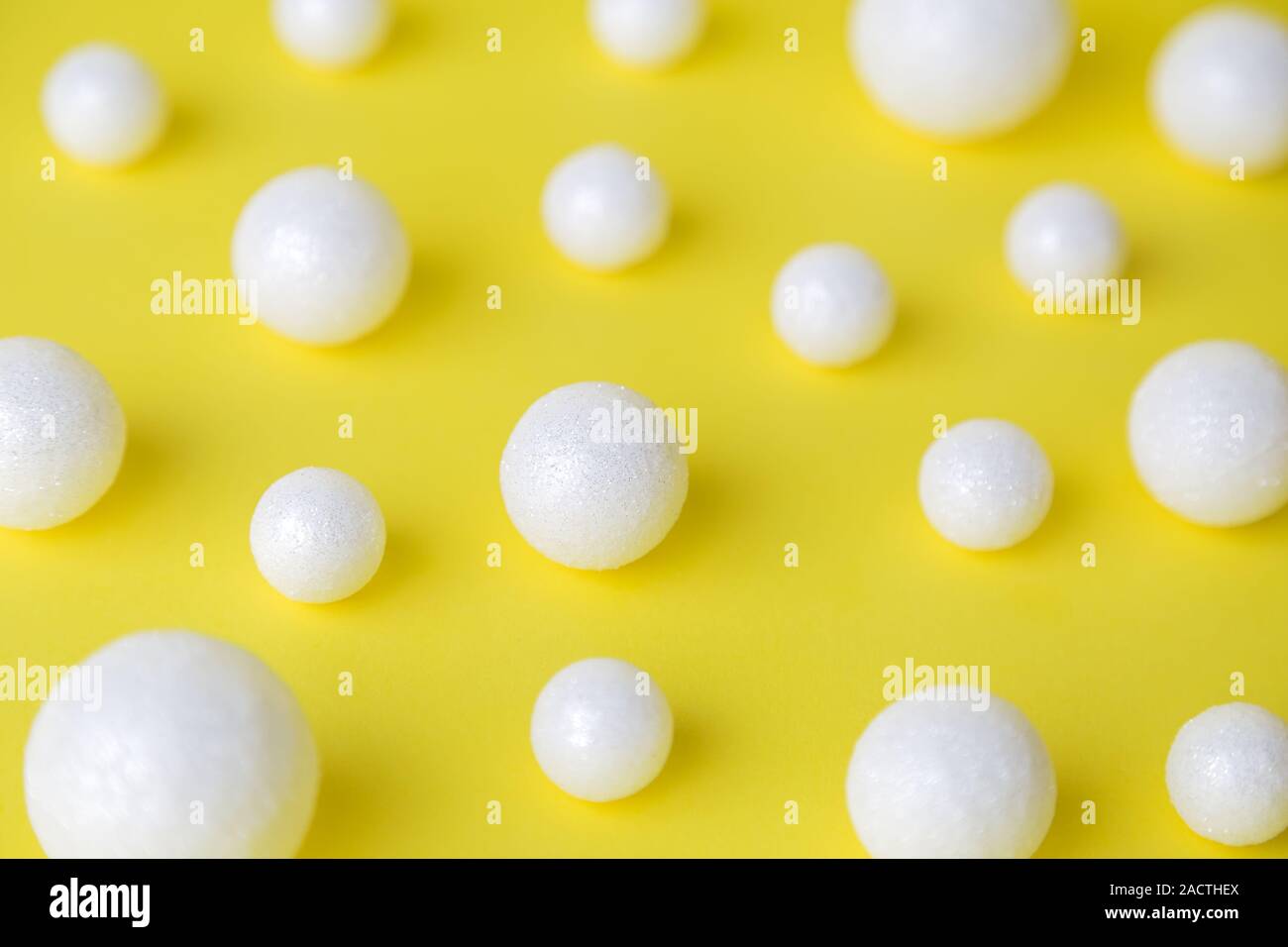 Bubbles made of styrofoam balls on pastel pink background minimal creative concept. Stock Photo