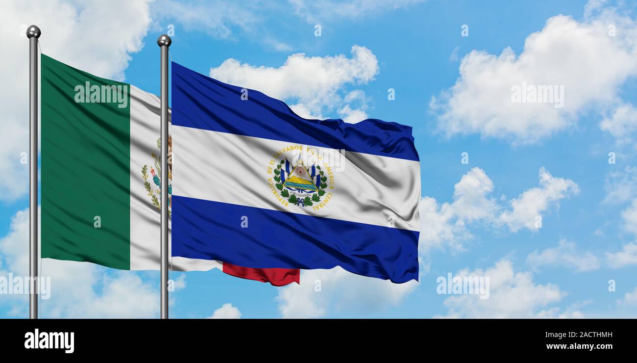 Mexico and El Salvador flag waving in the wind against white cloudy blue sky together. Diplomacy concept, international relations. Stock Photo