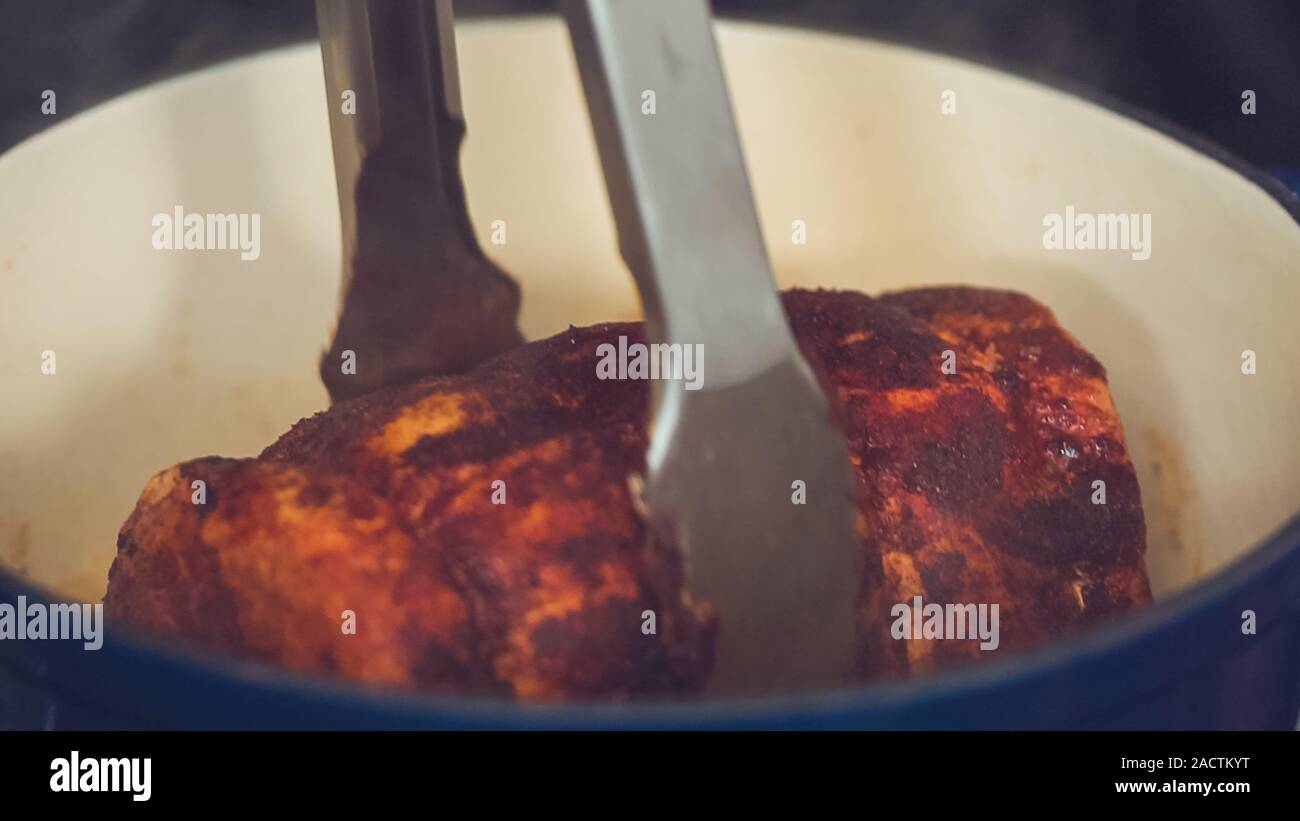Step by step. Cooking boneless pork roast in cast iron dutch oven Stock