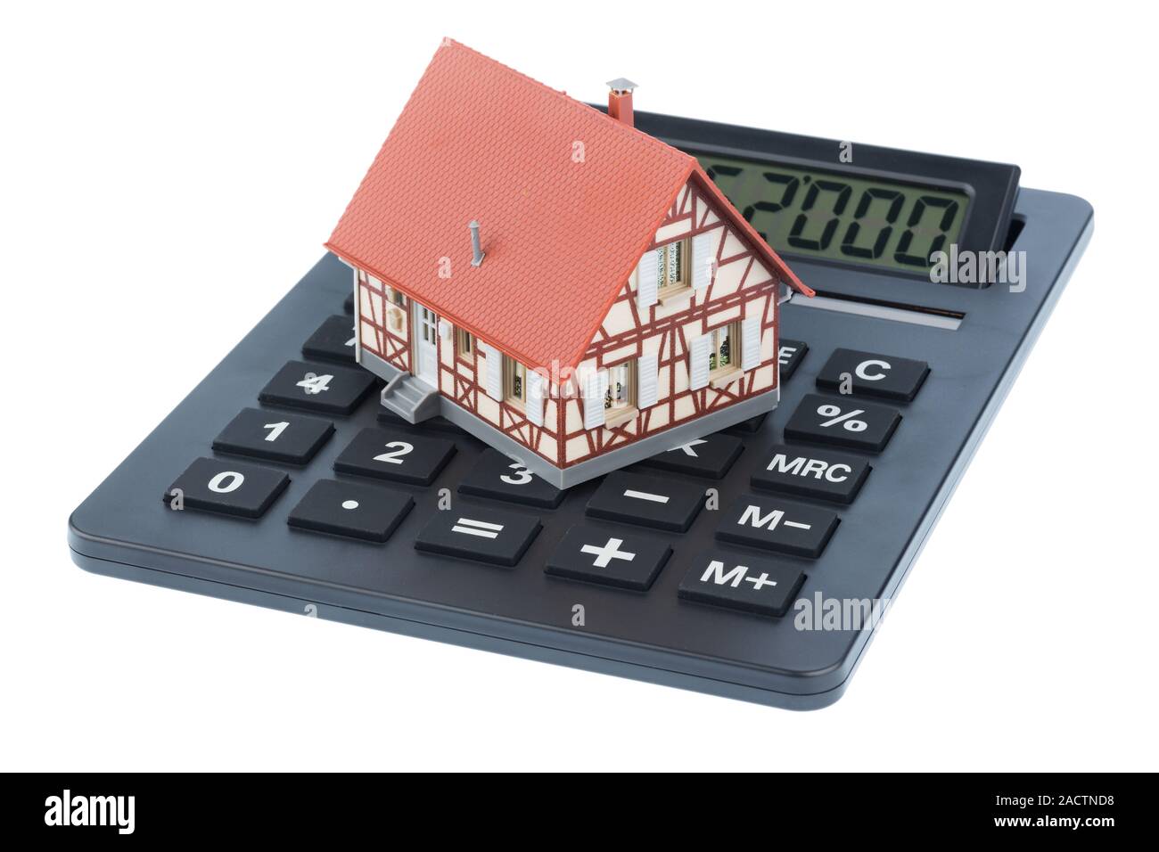 Residential house on calculator Stock Photo Alamy
