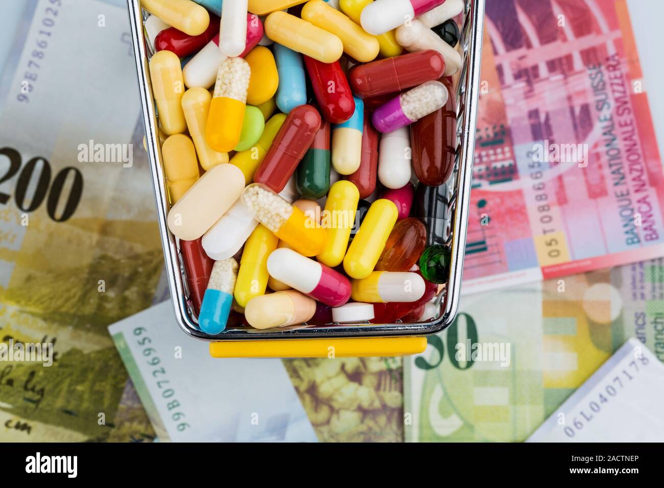 Tablets, shopping trolleys, banknotes Stock Photo